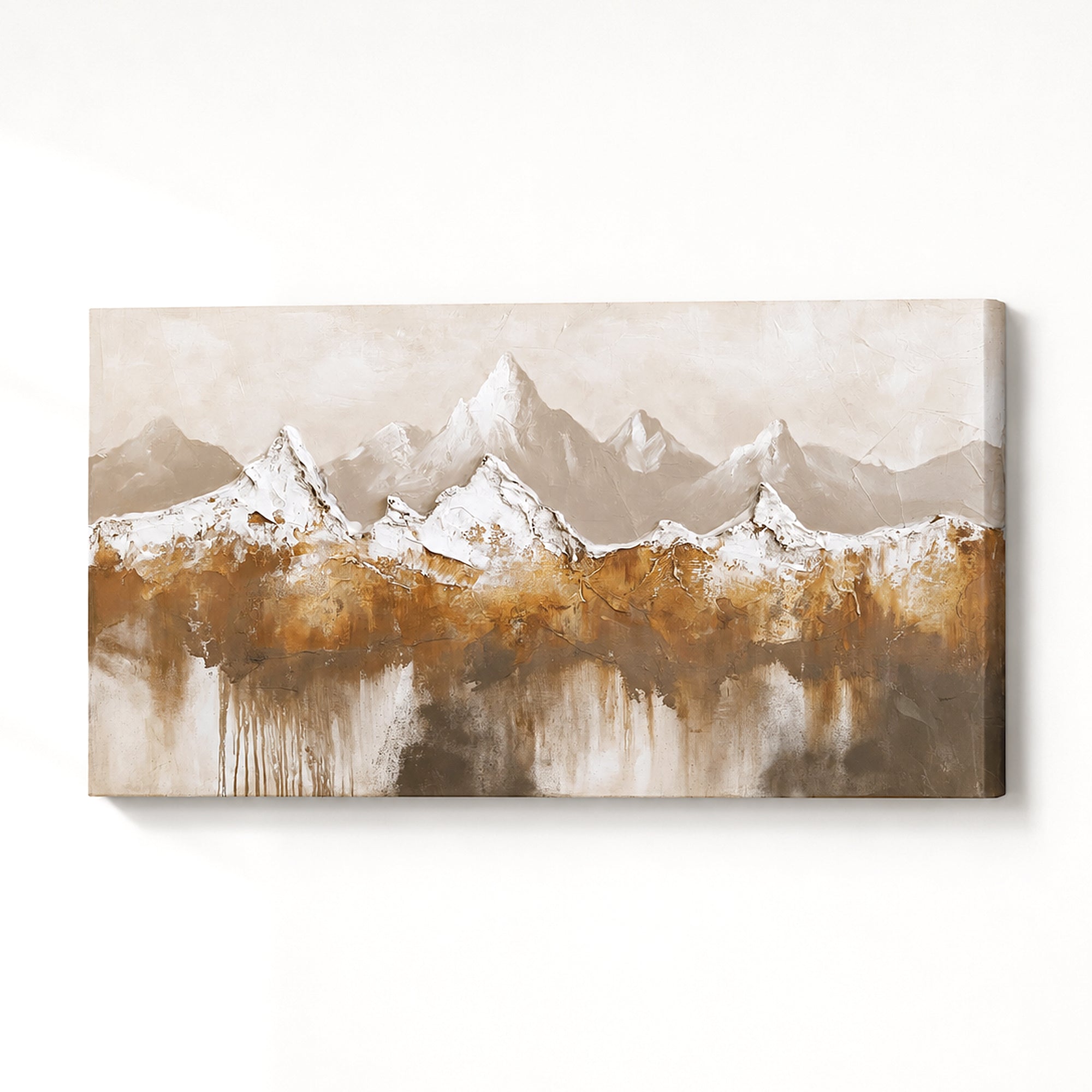 Horizontal canvas wall art featuring an abstract mountain landscape with snow-capped peaks and warm brown and beige tones, shown hanging against a white wall.