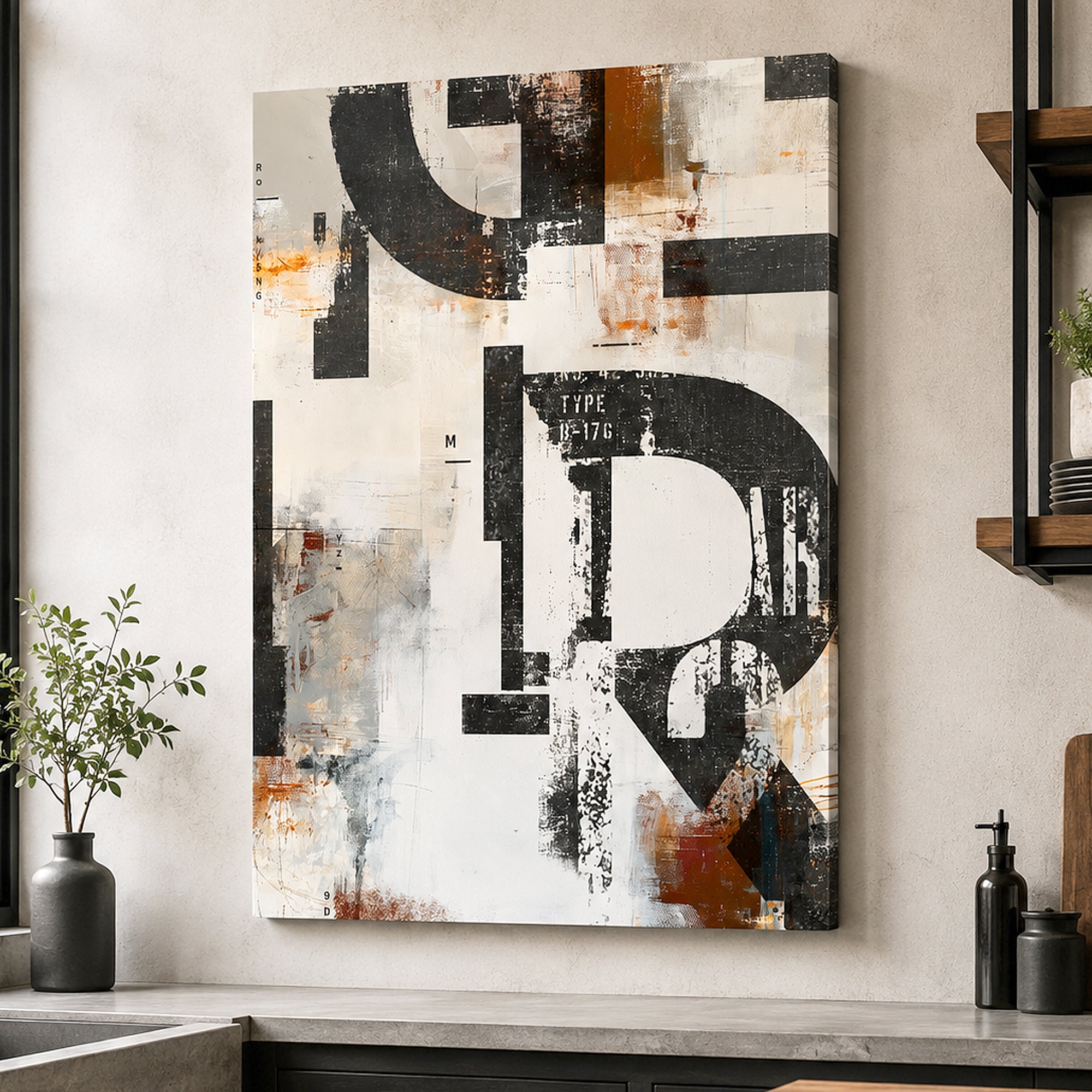 Abstract canvas wall art featuring large black letters over a textured off-white background with brown and gray accents, displayed in a modern bathroom setting above a sink.